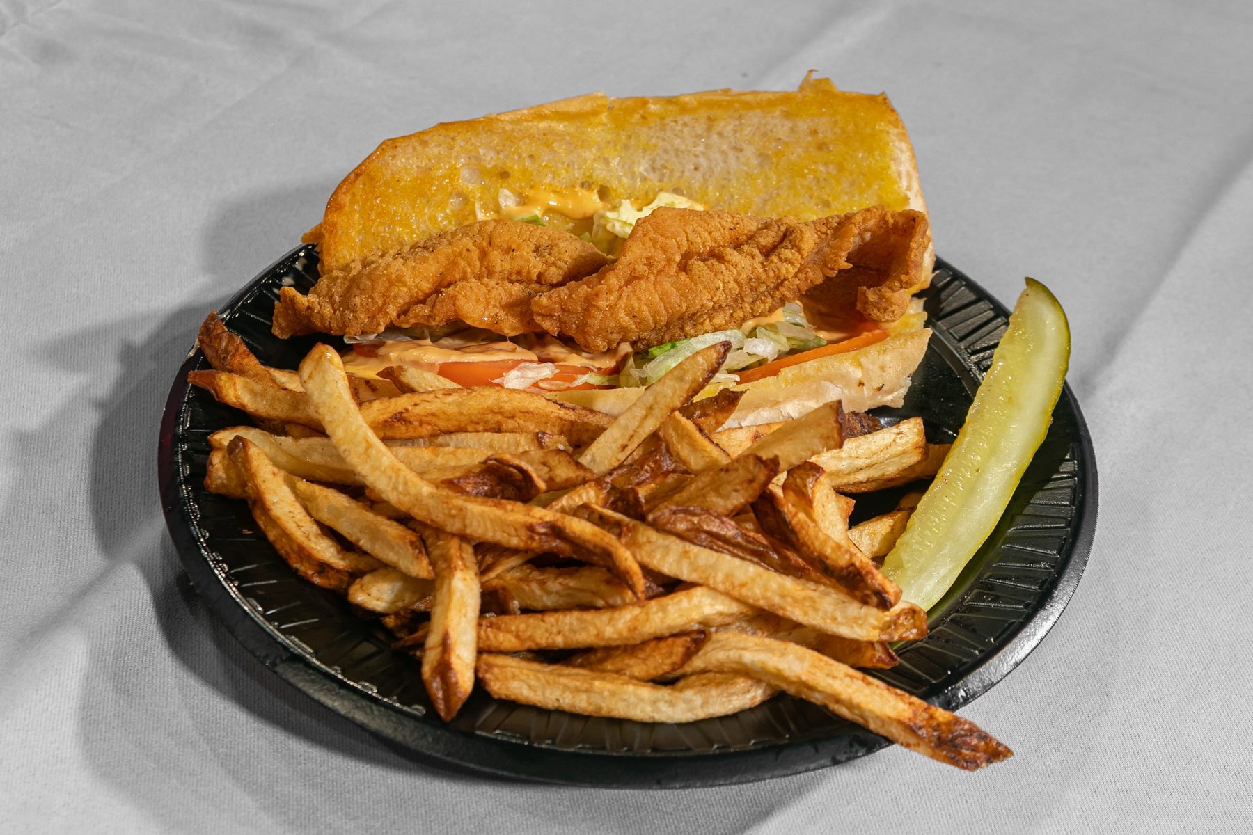 Catfish po'boy on a toasted pistolette